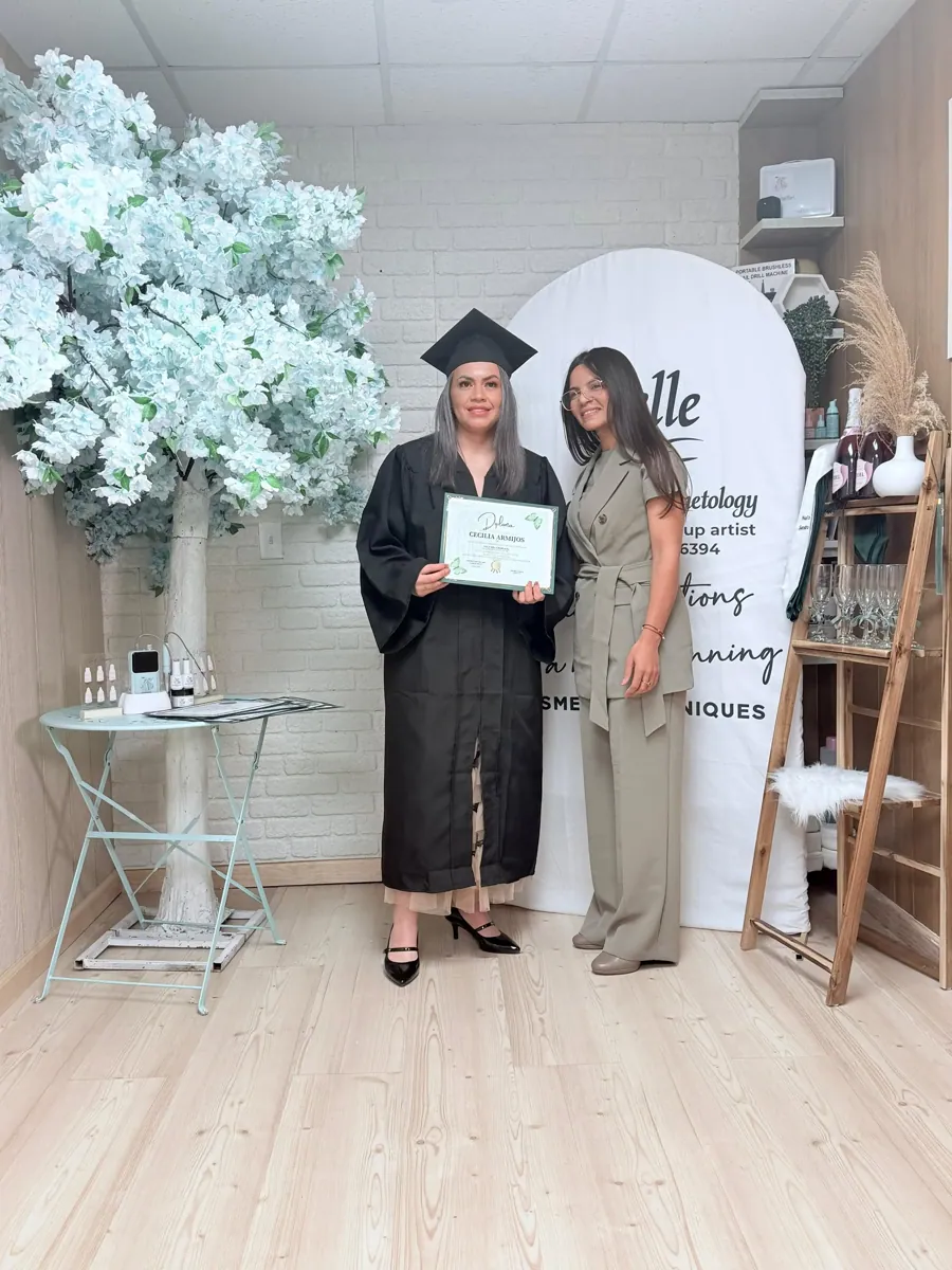 Belle Academy graduate with instructor in salon